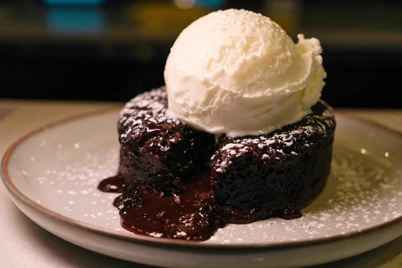Chocolate lava cake with ice cream at Rise & Dine Calgary SE