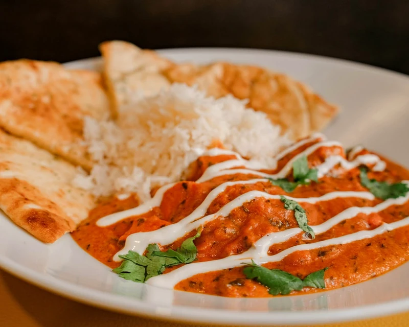 Butter chicken with basmati rice and naan